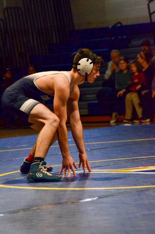 Sussex Academy senior Ryan Buckler begins the match low and ready to shoot or repel.