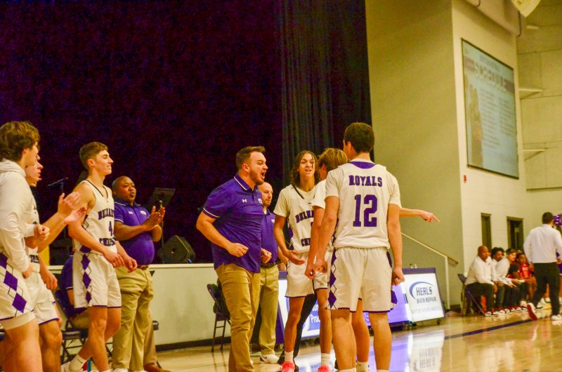The Delmarva Christian bench is pumped after junior Josh LoRusso hit a buzzer-beating three-pointer to trim MOT Charter’s lead down to 39-38 at the end of the third quarter of the Mustangs’ 62-49 win over the Royals Jan. 30. AARON R. MUSHRUSH PHOTOS