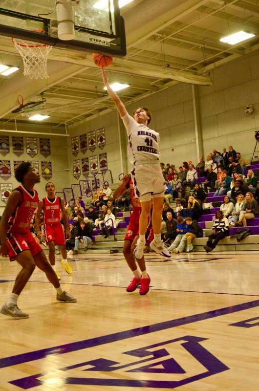 Delmarva Christian sophomore Asher Woods elevates toward the rim.