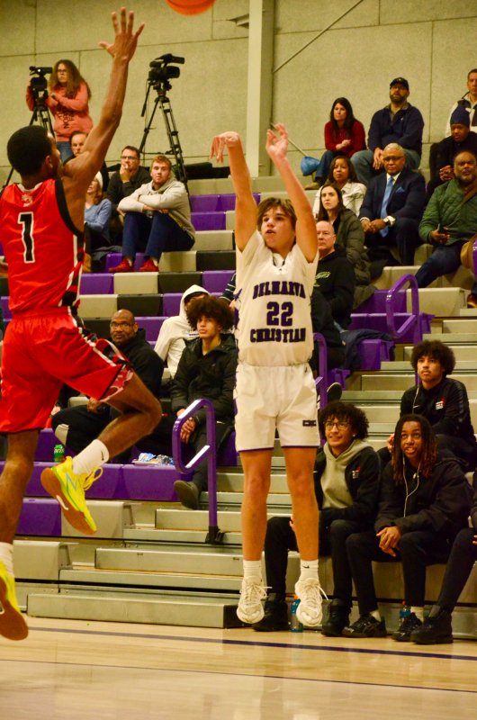 Delmarva Christian junior Josh LoRusso gets a shot off with Graling High closing in.