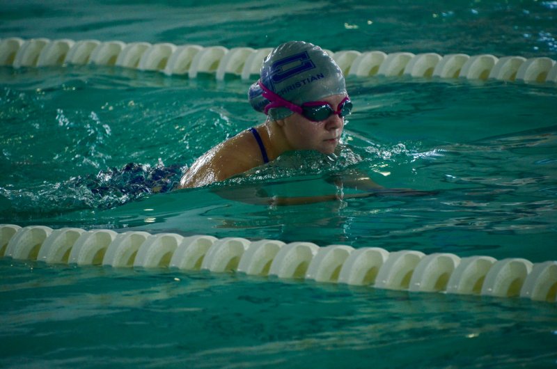 Royals sophomore Lilli Gschwandtner pops up focused during the breaststroke.