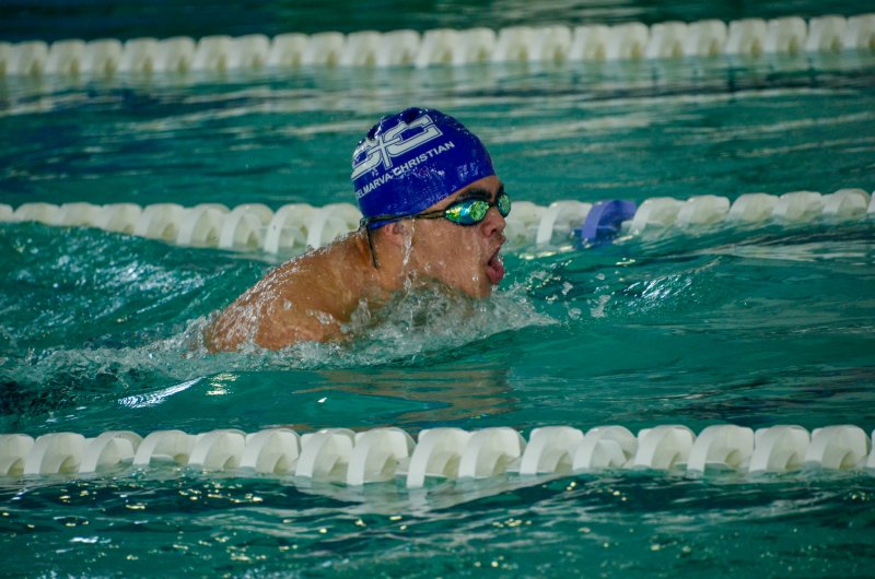 Delmarva Christian sophomore Cam Smithson surfaces during the breaststroke.