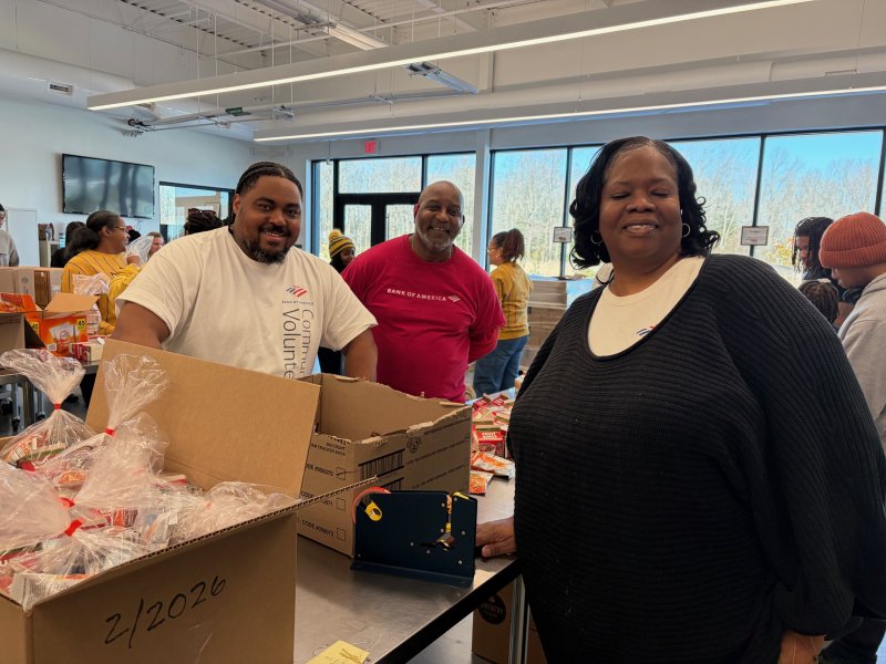 Packing boxes for distribution are (l-r) Chris West, Gregory Handy and Dianne Freberg.