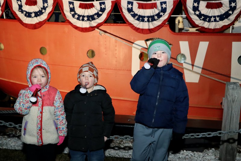 These young revelers could not wait to get the party started on New Year’s Eve at the Lightship Overfalls. Shown are (l-r) Lillian Robinson, Clark McGrath and James Robinson.