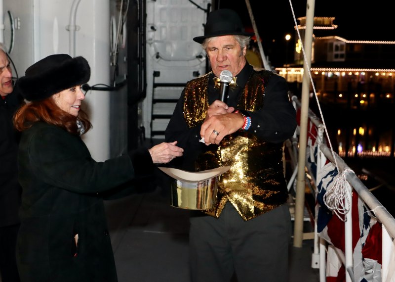 Mary Alice Kelly, Lewes 250 committee chair, left, and Dave Shook, Overfalls Foundation president, pick the winners from an online contest to drop the anchor and blow the ship’s foghorn at the early celebration.
