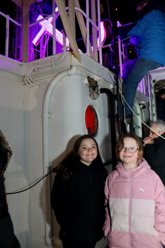 Sasha and Vivian Kearns are seen moments after they officially lowered the anchor on the deck of the ship. The girls had their names drawn from a list of online entries.