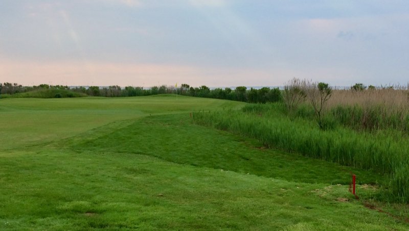 The second hole on the Bay Course at Seaview Resort, home of the ShopRite LPGA Classic in South Jersey. The green juts into the marshes of nearby Reeds Bay, creating risks of salt water flooding similar to Cape Region courses such as Cripple Creek CC and Rehoboth Beach CC.