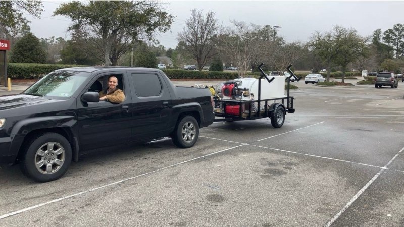 Alex Drager, co-owner of Richmill Power Washing, after picking up the company’s first power-washing trailer. SUBMITTED PHOTOS