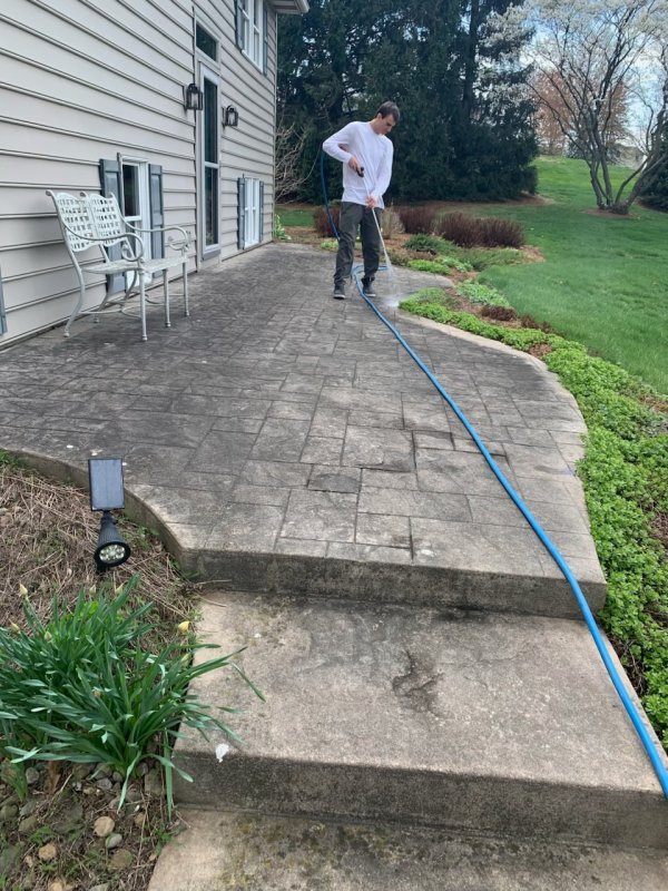 Luke Drager, co-owner of Richmill Power Washing, is hard at work on a client’s property.