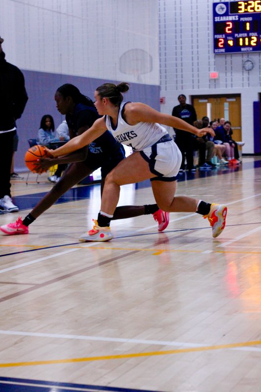 Sussex Academy junior Grayce Glover gets her hand on the ball to disrupt a pass.