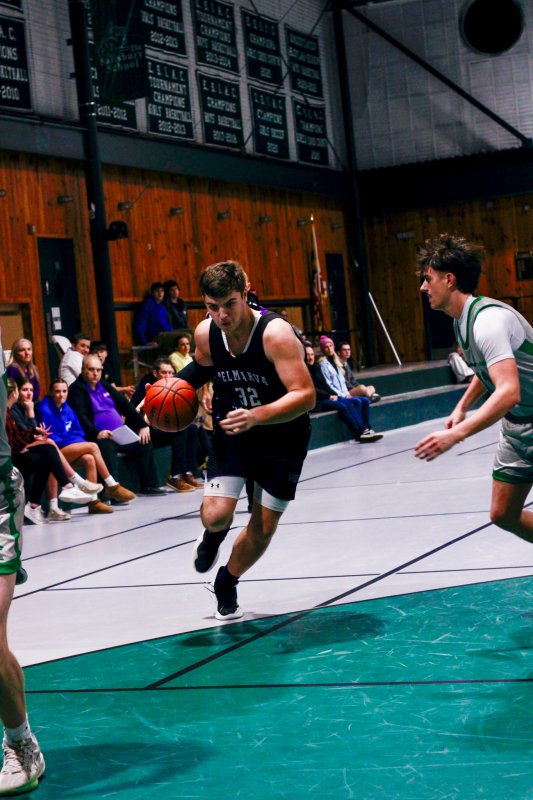 Royals senior Andrew Collins drives into the arc.