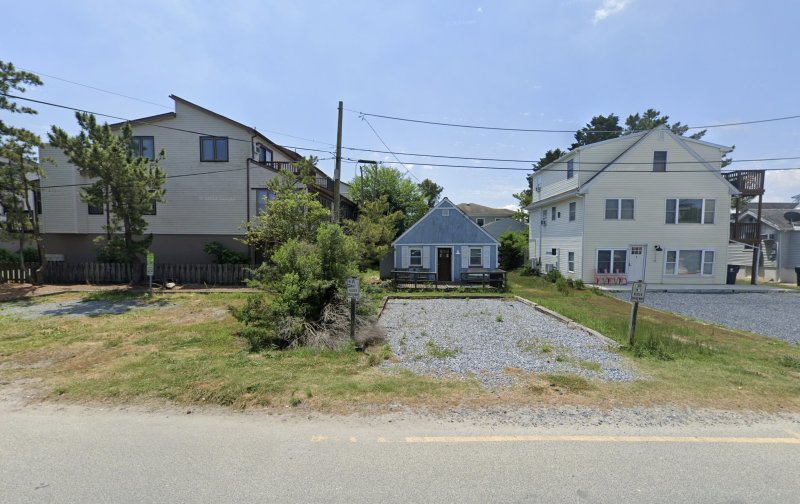 A screenshot of the June 2024 Google Maps Street View shows the small blue house that was previously located at 116 Dagsworthy Ave., the lot in the middle of the photo. This house has since been demolished, and Victoria Petrone and Vincent Dills are looking to build a new one in its place. PHOTO COURTESY OF GOOGLE MAPS