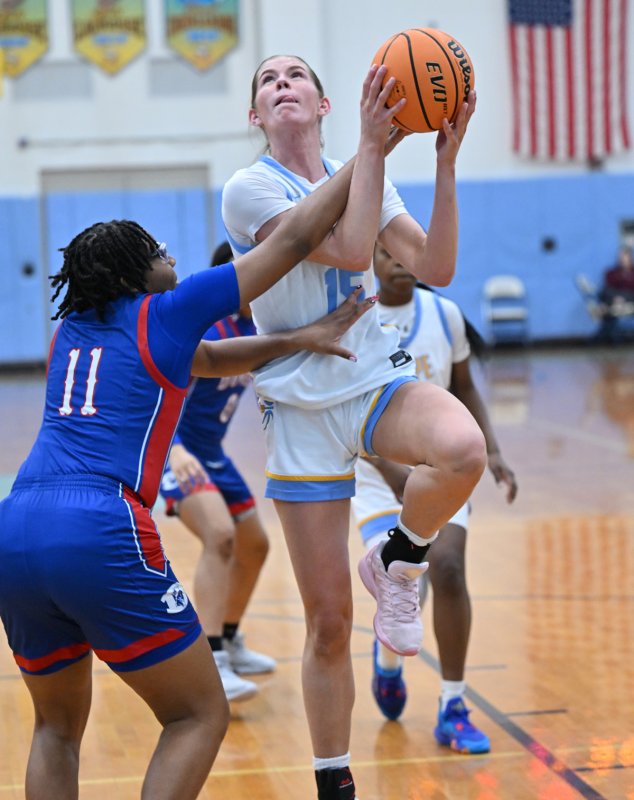 Cape senior Amalia Fruchtman is fouled by Auriana Moore while going to the hoop.