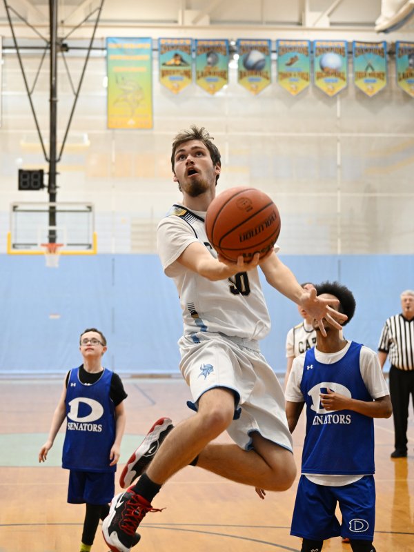 Junior Jaxon Benton glides in for a basket.