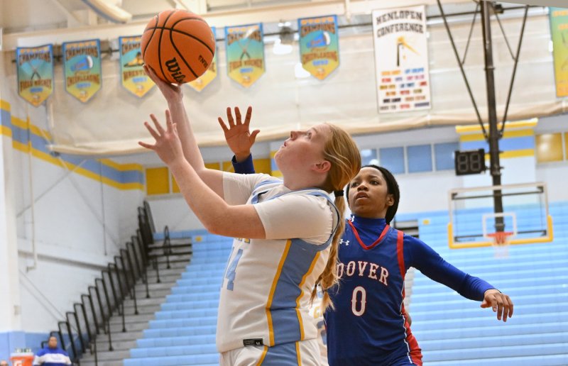 Cape senior Sydney Whetzel dries the baseline on Dover’s Ky'Asiah King.