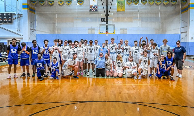 The Cape and Dover teams get together after a tough game. DAN COOK PHOTOS