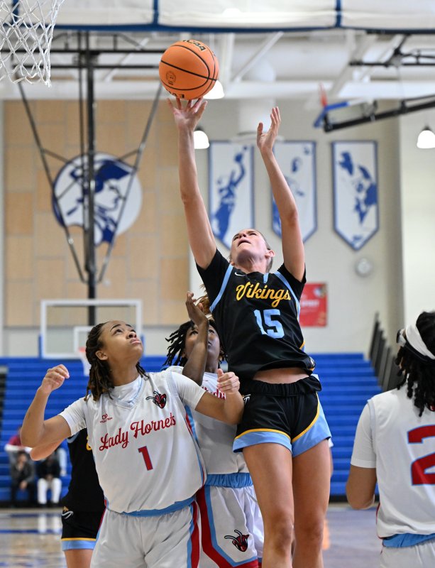 Cape senior Amalia Fruchtman goes strong to the basket on Early College’s Marshay Brown.