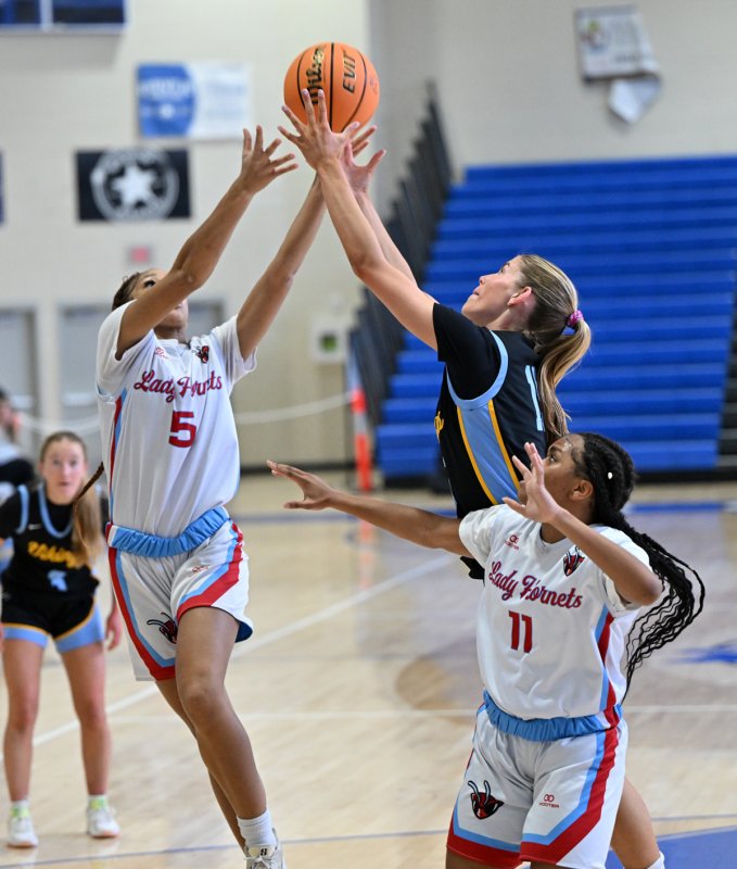 Cape senior Amalia Fruchtman snatches a rebound from Early College’s Jayla Dukes.