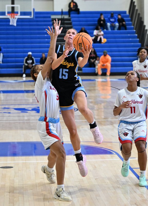 Cape senior Amalia Fruchtman goes up and under ECS’s Jayla Dukes.
