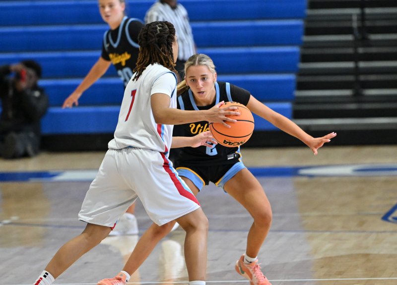Cape sophomore Mikaela Gordon plays close defense on the Hornets’ Marshay Brown.