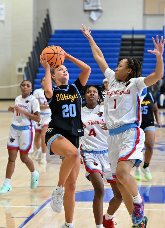 Cape junior forward Ally Diehl goes in on Early College’s Marshay Brown.