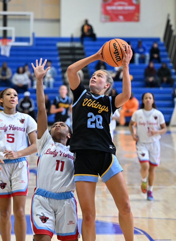Cape’s Ally Diehl hits in close.