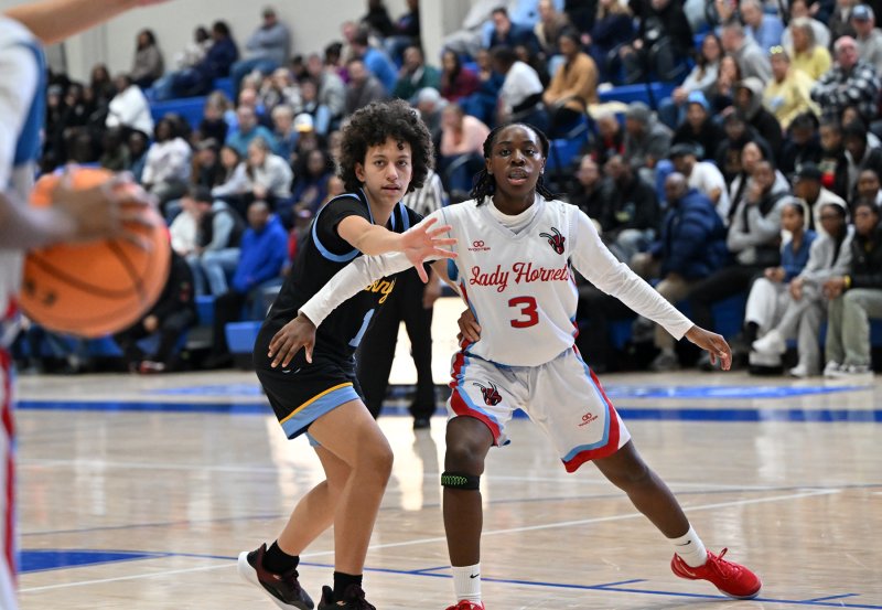 Cape senior Erinn Rodriguez denies Early College’s Ava Brickhouse-Reid.