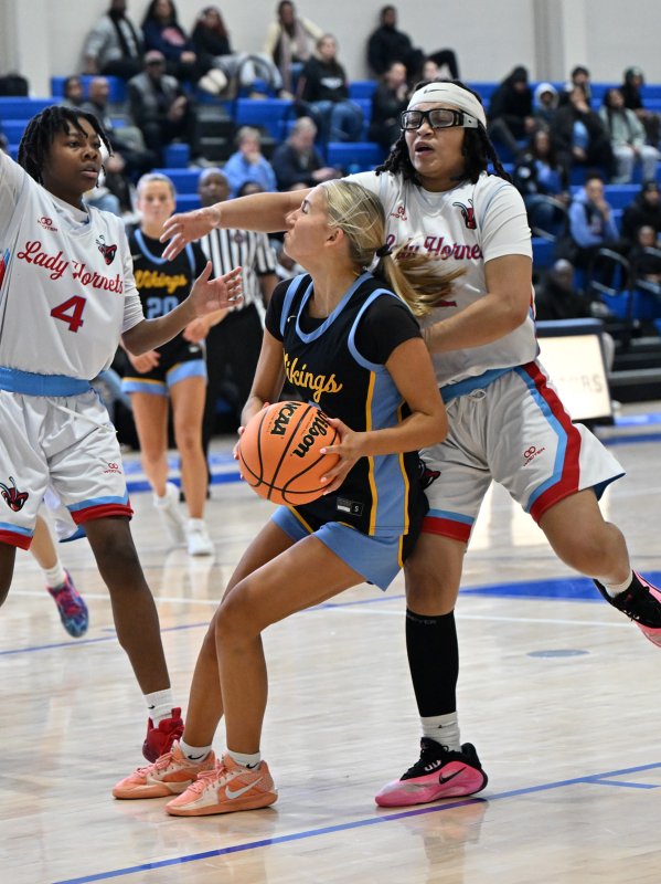 Mikaela Gordon is fouled by Early College’s Ashyra Brown.