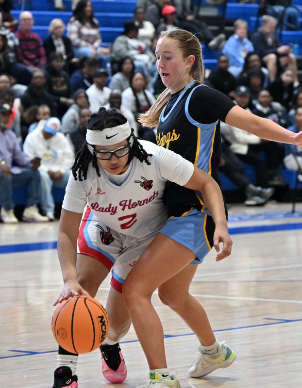 Cape’s Mairead Rishko goes for the block on Early College’s Ashyra Brown.