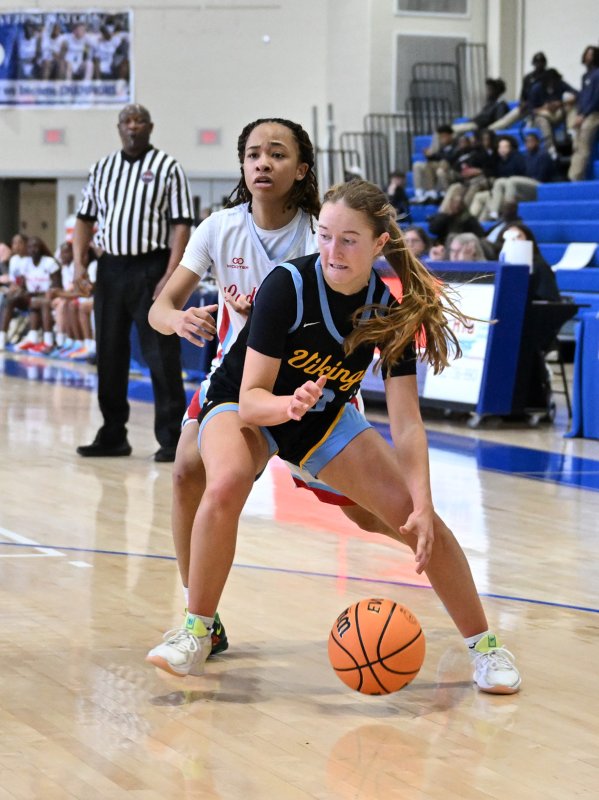 Cape junior Mairead Rishko drives on Early College’s Marshay Brown.
