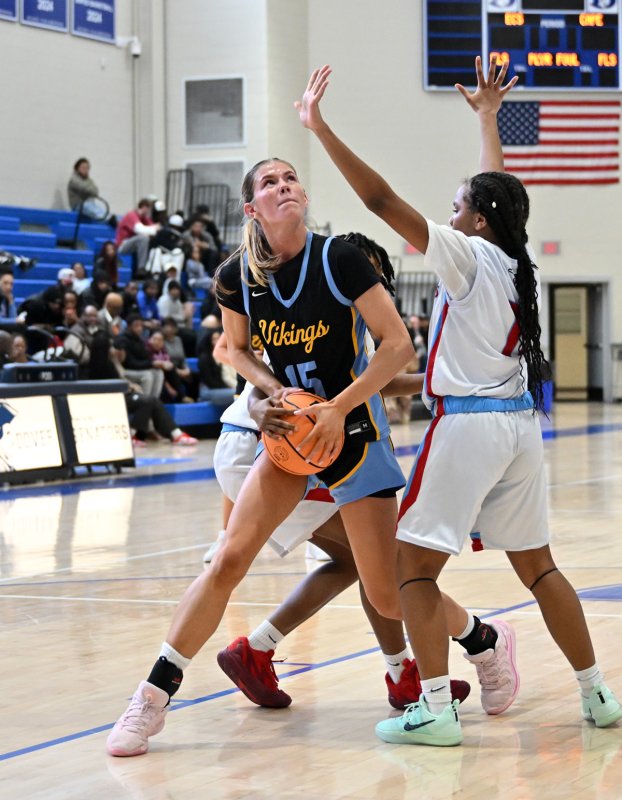 Cape senior Amalia Fruchtman goes up to the hoop on Early College’s Sharon Rodney.