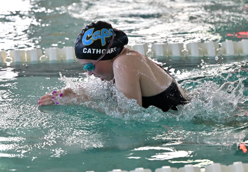 Caper senior Rylie Cathcart swims the breast leg of the medley relay.