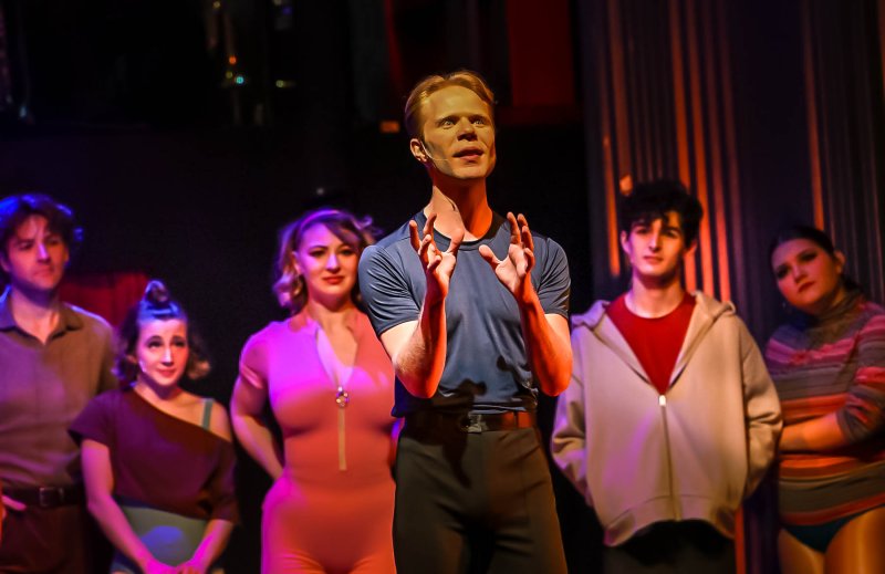 Mark Anthony, aka Jacob Fischer, sings “Hello Twelve, Hello Thirteen Hello Love.”