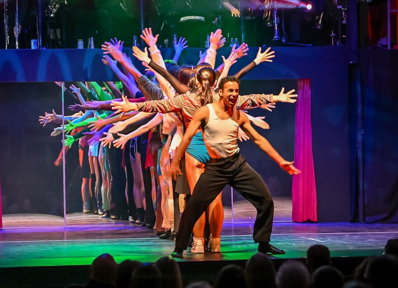 Ritchie Walters, aka Josiah Thomas, leads the group in “Gimme The Ball” during “A Chorus Line” at Milton Theatre. DAN COOK PHOTOS