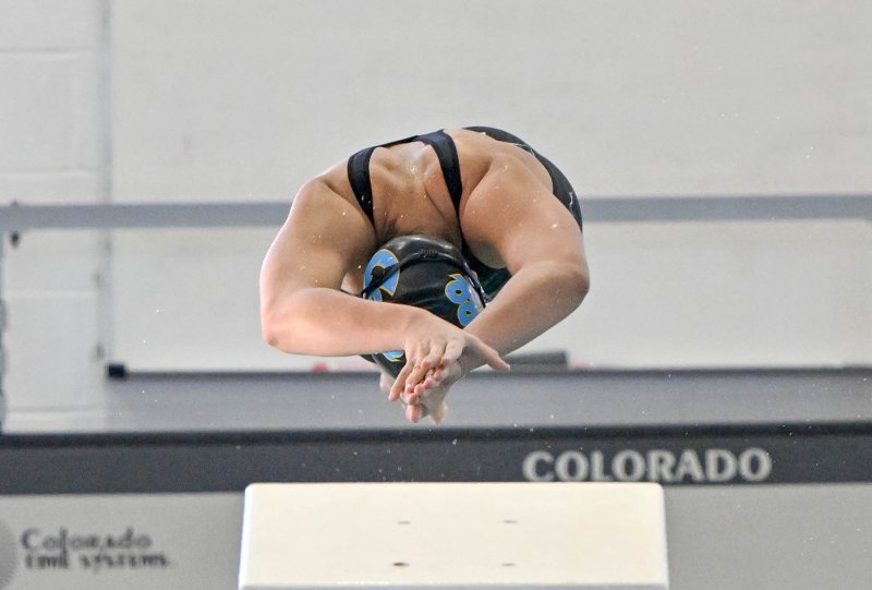 Cape junior Mia Jaoude leaves the blocks in the 100 butterfly that she won with a 1:00.39.