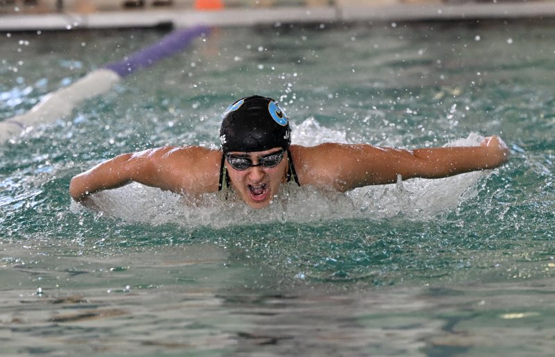 Cape junior Mia Jaoude wins the 100 butterfly in 57.38.
