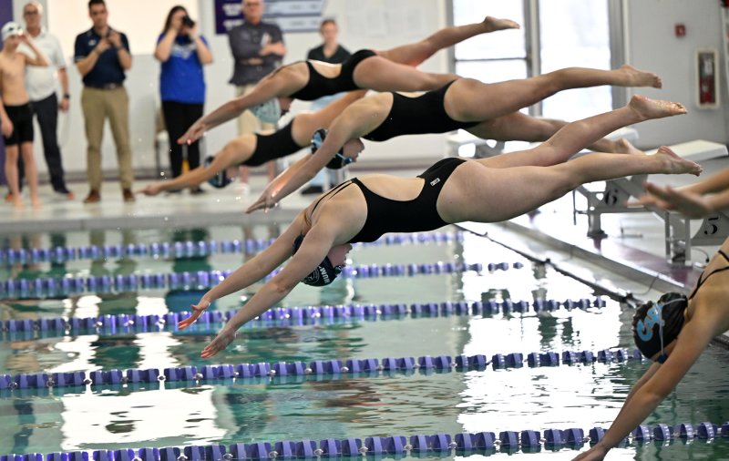 Sussex Academy junior Anna Mumford leaves the blocks in the 100 free.