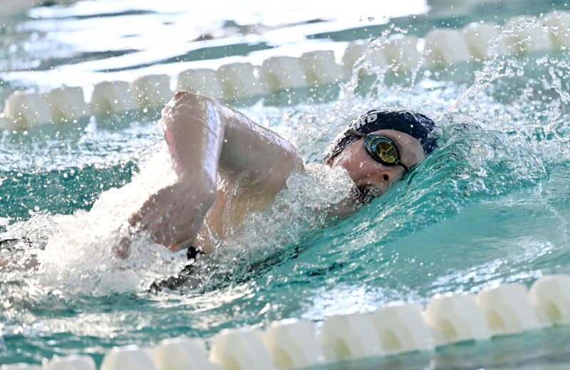 Sussex Academy junior Anna Mumford wins the 100 freestyle with a time of 53.96.