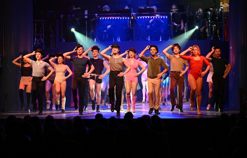 The company performs the tap dance.