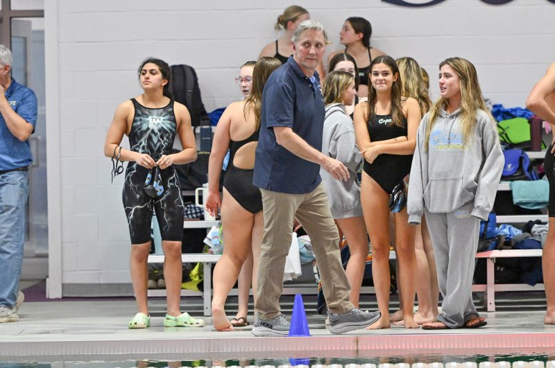 Cape coach Bill Geppert watches as his girls’ relay.