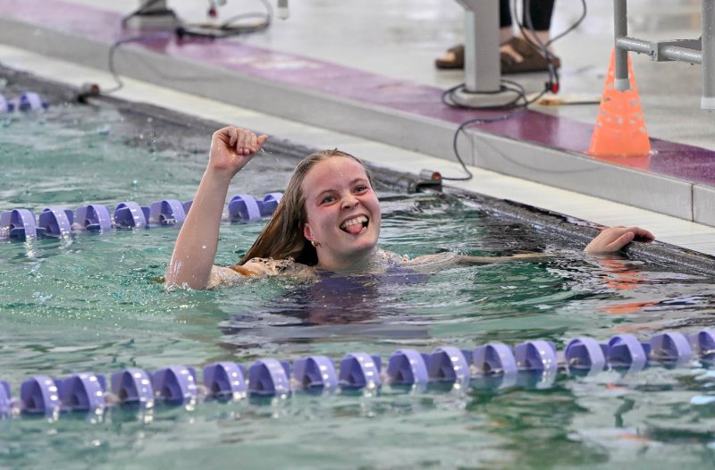 Sussex Academy junior Anna Mumford celebrates her winning time of 4:56.76 in the 500 free.