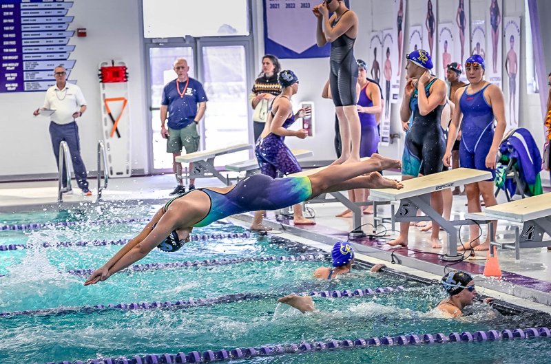 Cape junior Mia Jaoude leaves the blocks in the 400 free relay. She joined Isla Touw, Hayden Hazzard and Sidney Caldwell to take first with a time of 3:40.46.