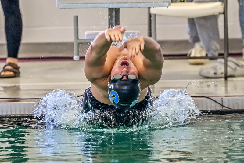 Cape senior Ryan Morgan leaves the blocks in the 100 backstroke. He swam to fifth-place finish in 1:01.00.