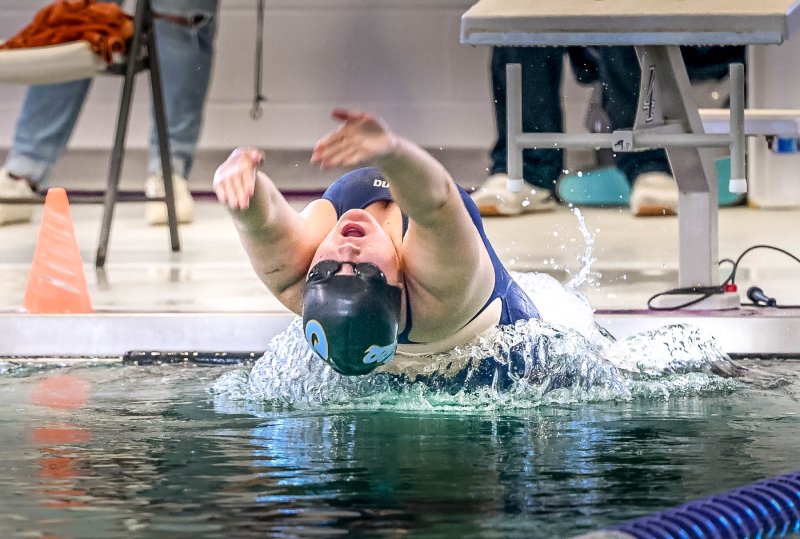 Cape sophomore Quinn Pidgeon swims the 100 backstroke in a time of 1:16.39.