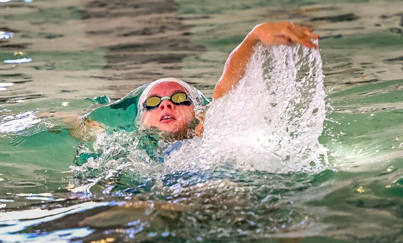 Sussex Academy senior Victoria Evans swims to second in the 100 backstroke with a time of 1:00.53.