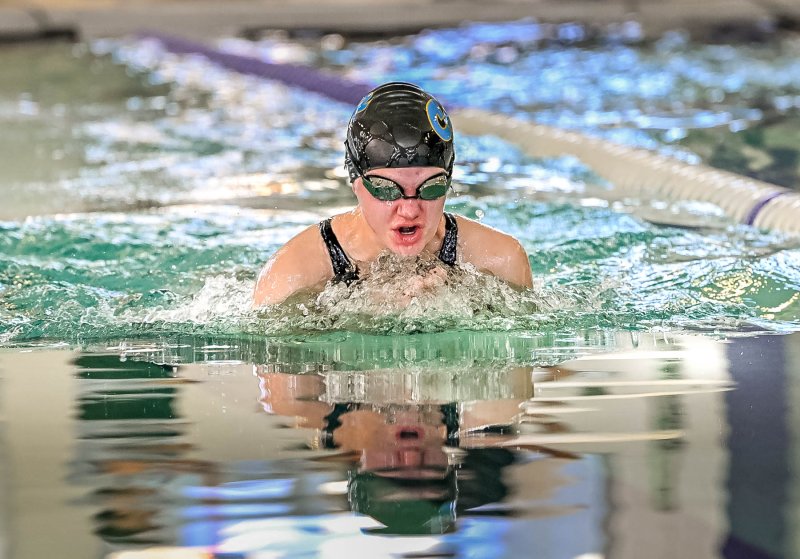 Cape freshman Julia Moore swims to a time of 1:23.89 in the 100 breaststroke.