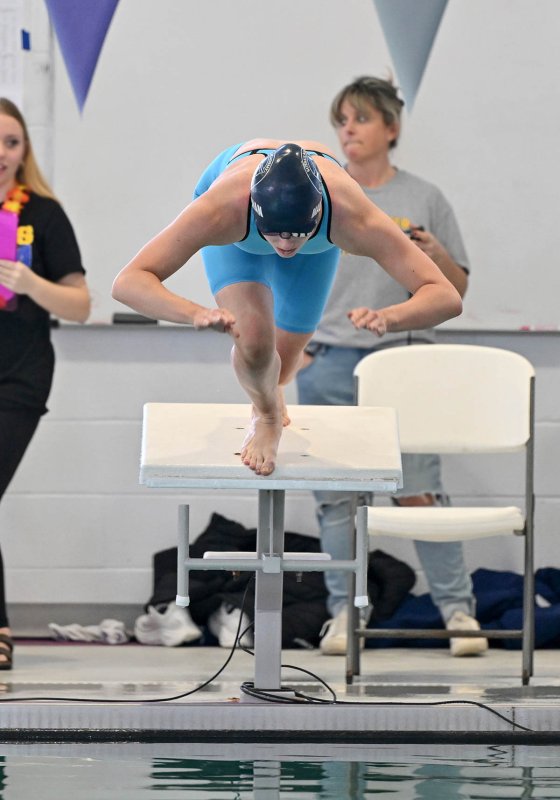 Sussex Academy sophomore Gretchen Maughan leaves the blocks in the 100 breaststroke. She swam to second place with a time of 1:08.38.