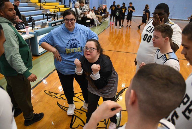 Cape assistant coach Sara Davis gets the team pumped before the game.