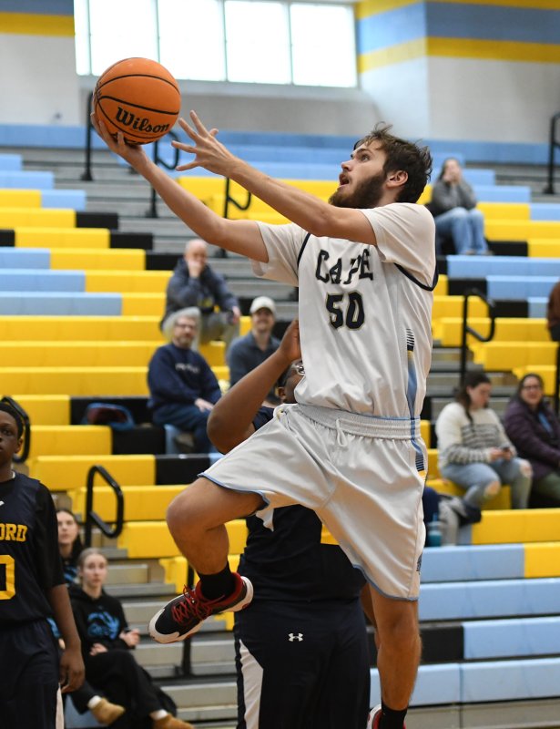 Junior Jaxon Benton glides in for a basket.