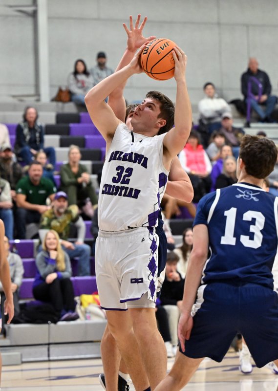 Royals senior forward Andrew Collins hits in the paint.